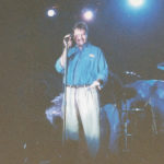 Burke Allen on stage introducing Rick Springfield in Las Vegas - 1999